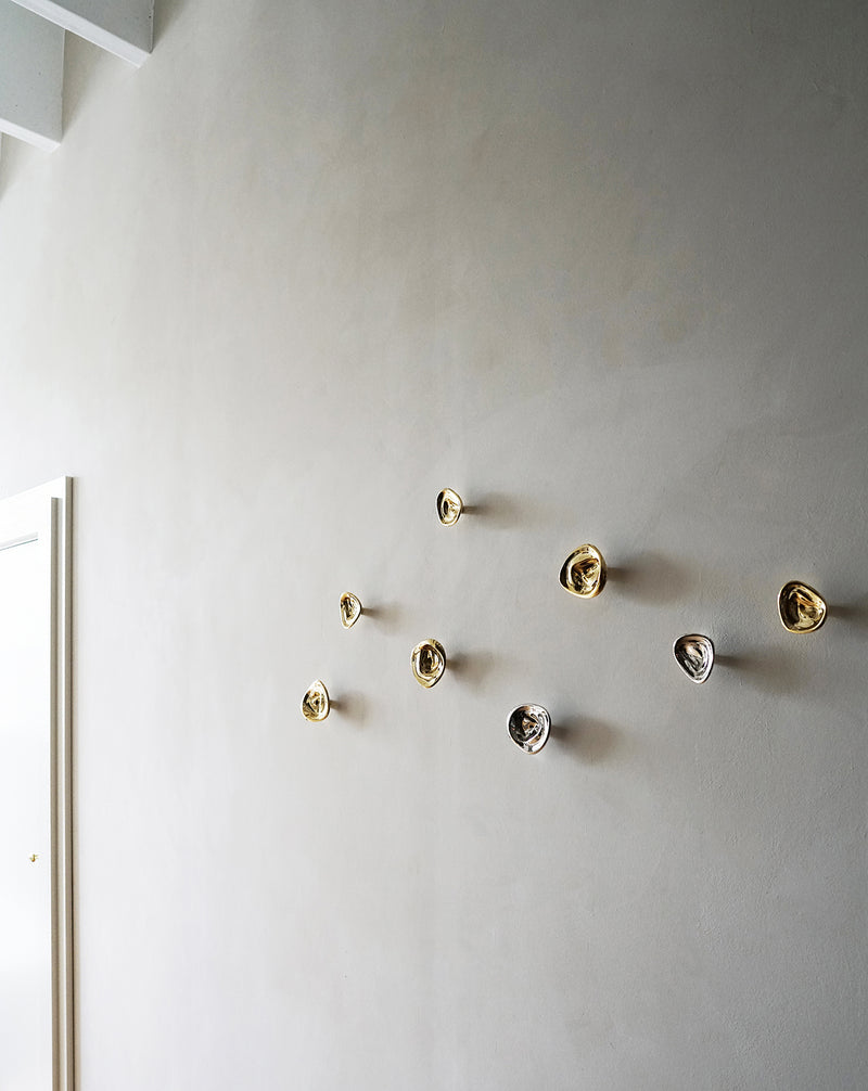Hein Studio knobs and hooks in brass and steel